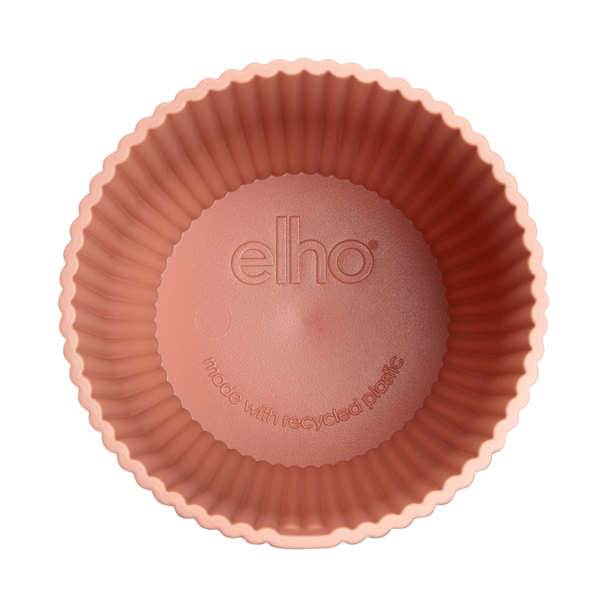 Overhead shot of inside of pink decorative pot with 'elho' branding on a white background