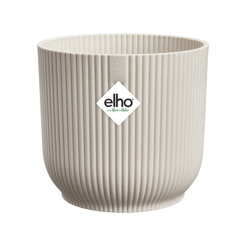 Beige ribbed plant pot with elho logo on a white background